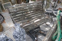 An old garden bench, various bench ends and two bistro chairs