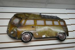A metal wall plaque depicting a split screen VW Camper