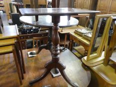 A Victorian mahogany tripod table having oblong top, one other tripod table and a stool