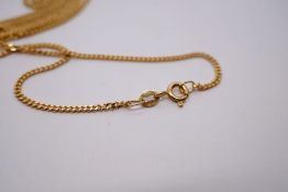 9ct yellow gold fine curb link necklace hung with 9ct gold cross inset with pink, possibly sapphires