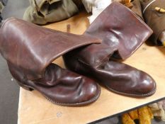 A pair of brown leather military officer's boots and military jodhpurs