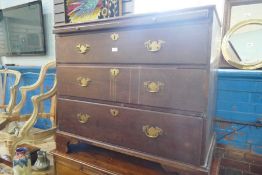 A Georgian mahogany chest having 3 long drawers, with brushing slide