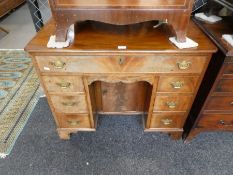 A 19th century mahogany kneehole desk, having one long and 6 short drawers, with concealed frieze dr