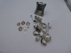 A quantity of silver teaspoons, coffee spoons etc. Marked with some foreign and comprising souvenir