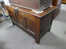 An antique oak coffer having panelled front, 111cm