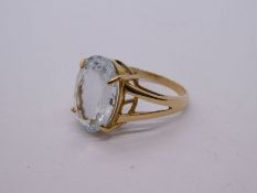 9ct yellow gold dress ring set large oval cut aquamarine in 4 claw mount on split shoulders, marked