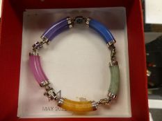 Chinese silver and jade multi coloured bracelet, each jade link separated by a coloured gemstone, 92