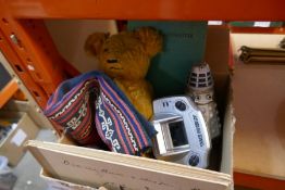 A box of mixed vintage items including silver thimbles, trench art, books, teddy bear, Dalek, etc an