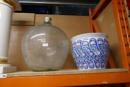 A large glass Carboy and other items
