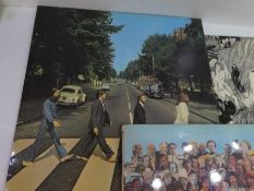 A Beatles White vinyl LP Album, and three others, including 'Revolver'