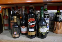 A large selection of various bottles of alcohol and beers