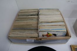 A carton of Victorian and later postcards, many hundreds