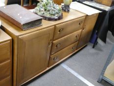 Ercol, an elm sideboard having three central drawers flanked by cupboards, 155cm