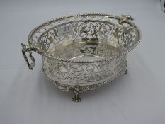 A charming George V silver bowl of ornate and decorative oval form. This lovely example has pierced,