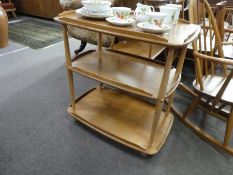 Ercol, An elm 3 tier tea trolley and a small quantity of Strawberry decorated teaware