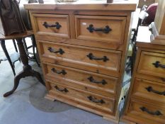 A Mexican pine chest, having 2 short and 3 long drawers