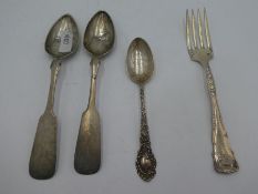 An ornate sterling fork with engraved 1895 on the handle. Also with a sterling ornate spoon engraved