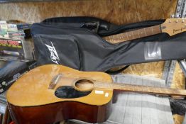 An Encore Acoustic guitar and a Yamaha Pacifica electric guitar, with soft case