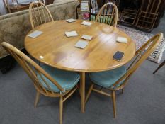 Ercol, an elm two flap kitchen table and a set of 4 stick back chairs, table width 113cm