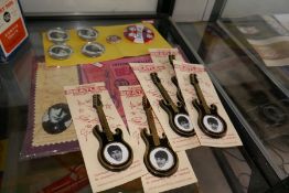 A lot of Beatles badges, some in the form of guitars and sundry