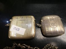 Two larger vesta cases both with etched stripe design. One having decorative central initial cartouc