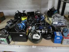 A quantity of fishing reels by Mitchell Abu Garcia and others