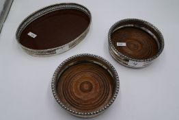 An oval tray having silver pierced design border marked silver. Also with a pair of silver Georgian