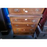 A pair of reproduction mahogany four drawer chests