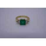 18ct yellow gold emerald and diamond 3 stone ring, with square cut emerald flanked either side with