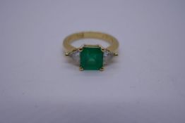 18ct yellow gold emerald and diamond 3 stone ring, with square cut emerald flanked either side with