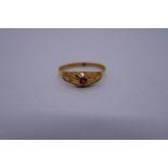 High carat yellow gold ring with single ruby, Size S, marked LJ, 1.7g approx
