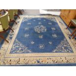 An old Chinese blue and cream carpet 294 x 243cm