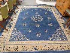 An old Chinese blue and cream carpet 294 x 243cm