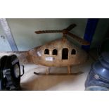 A metal model of a helicopter