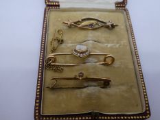 Antique tooled leather brooch box containing 3 gold brooches including one with heart shape moonston