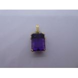 14ct yellow gold pendant with large rectangular 4 claw mounted amethyst below rope twist decorated i