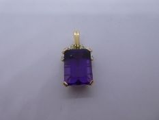 14ct yellow gold pendant with large rectangular 4 claw mounted amethyst below rope twist decorated i