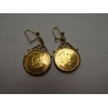 Pair of 9ct yellows gold mounted 22 ct half sovereigns, both date 2000, gross weight 10.3g