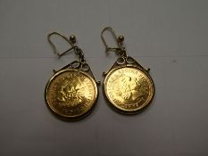Pair of 9ct yellows gold mounted 22 ct half sovereigns, both date 2000, gross weight 10.3g