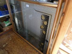A retro display cabinet having sliding glass doors