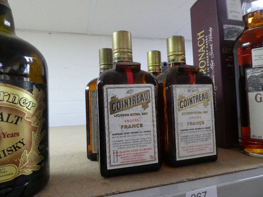 Four 70cl bottles of Cointreau