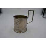 A Russian silver cup with decorative engraved floreated pattern, having interesting handle. Pos