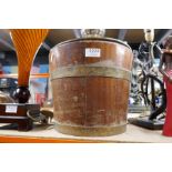 An old brass bound teak bucket having swing handle