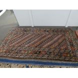 An old Caucasian rug having central repeated design, a vintage multicoloured rug and one other, the