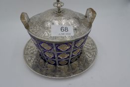A very eye catching early Victorian silver and glass enamel butter dish with ornate engraved silver