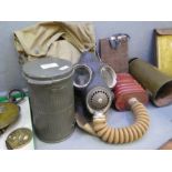 World War II Military issue gas mask (1940) in canvas bag, Civilian gas mask in tin and World War I