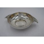 An Edwardian silver porringer, with hammered design body inside, and two pierced handles. Hallmarke