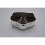 A silver tortoise shell trinket box of high quality and decorative design, on four feet. Hallmarked