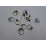 A tray of contemporary silver dress rings, some set with opals and a green hardstone example.