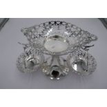 A high quality Mappin and Webb silver epergne having pierced decoration. With a central dish on demi